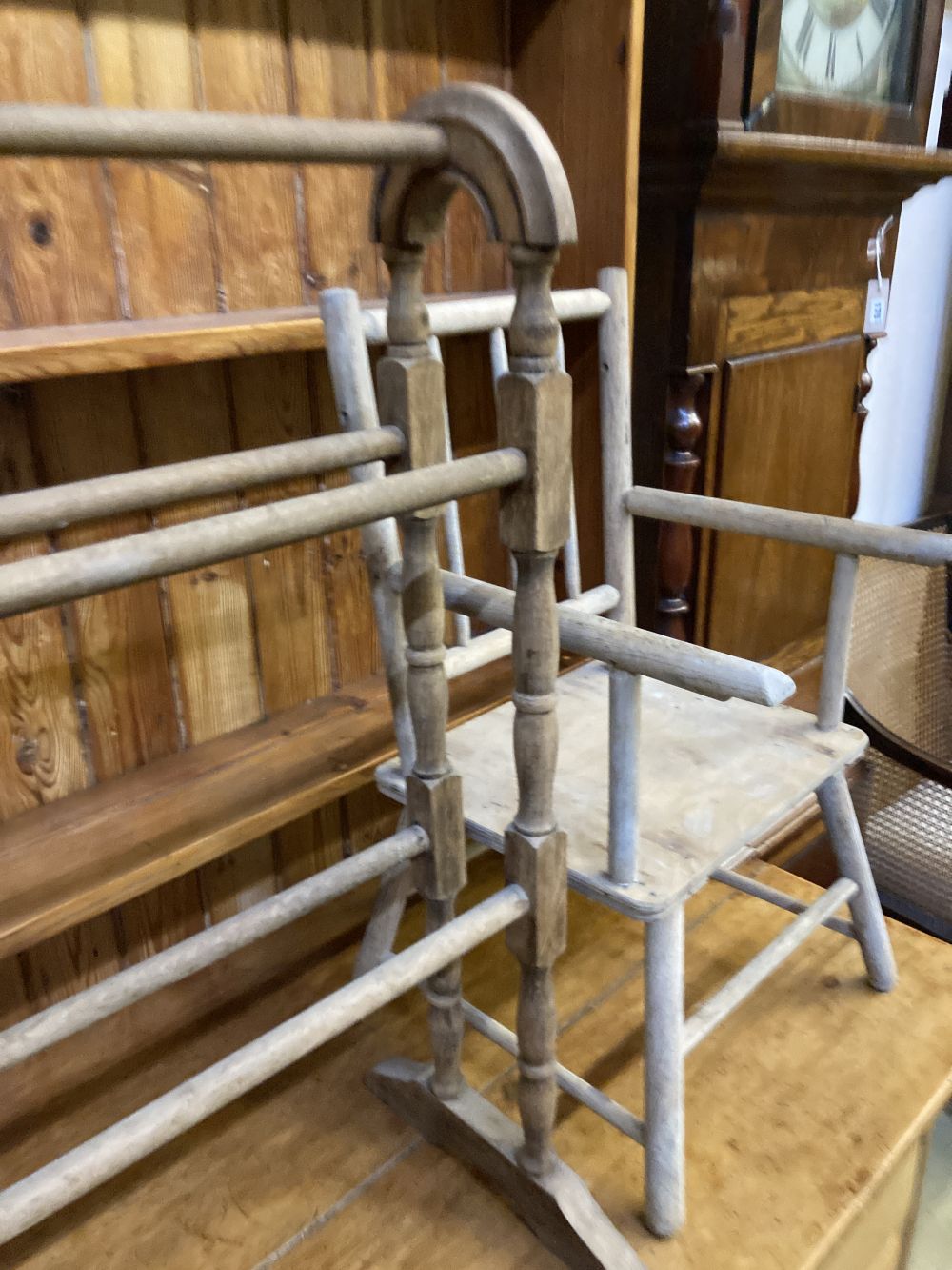 A Victorian towel rail, a primitive childs elbow chair and a metamorphic chair